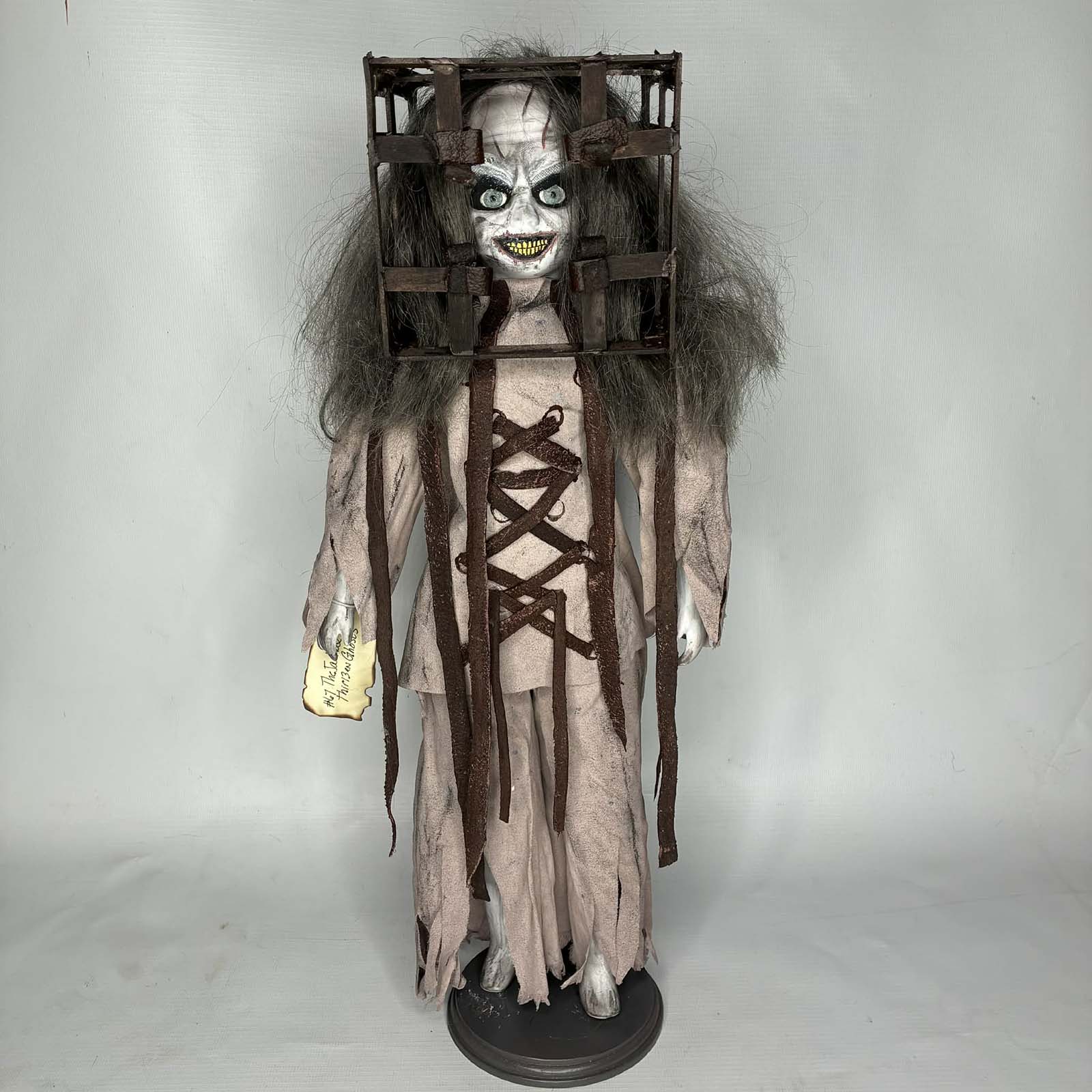 Creepy asylum ghost doll for sale by Erika’s Emporium with cage-style head
